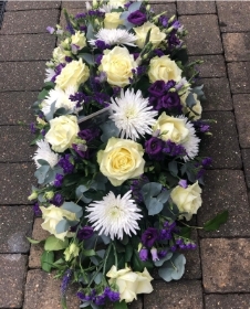 Purple and white coffin spray