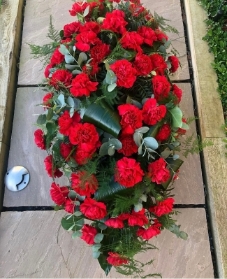 Red carnation coffin spray